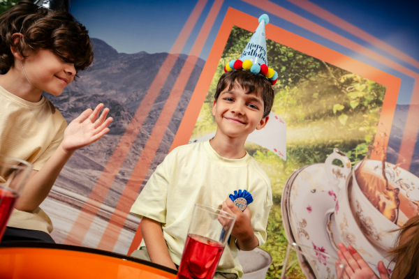 a child wearing a party hat